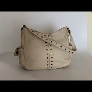The SAK cream colored large handbag with studs. Very good condition